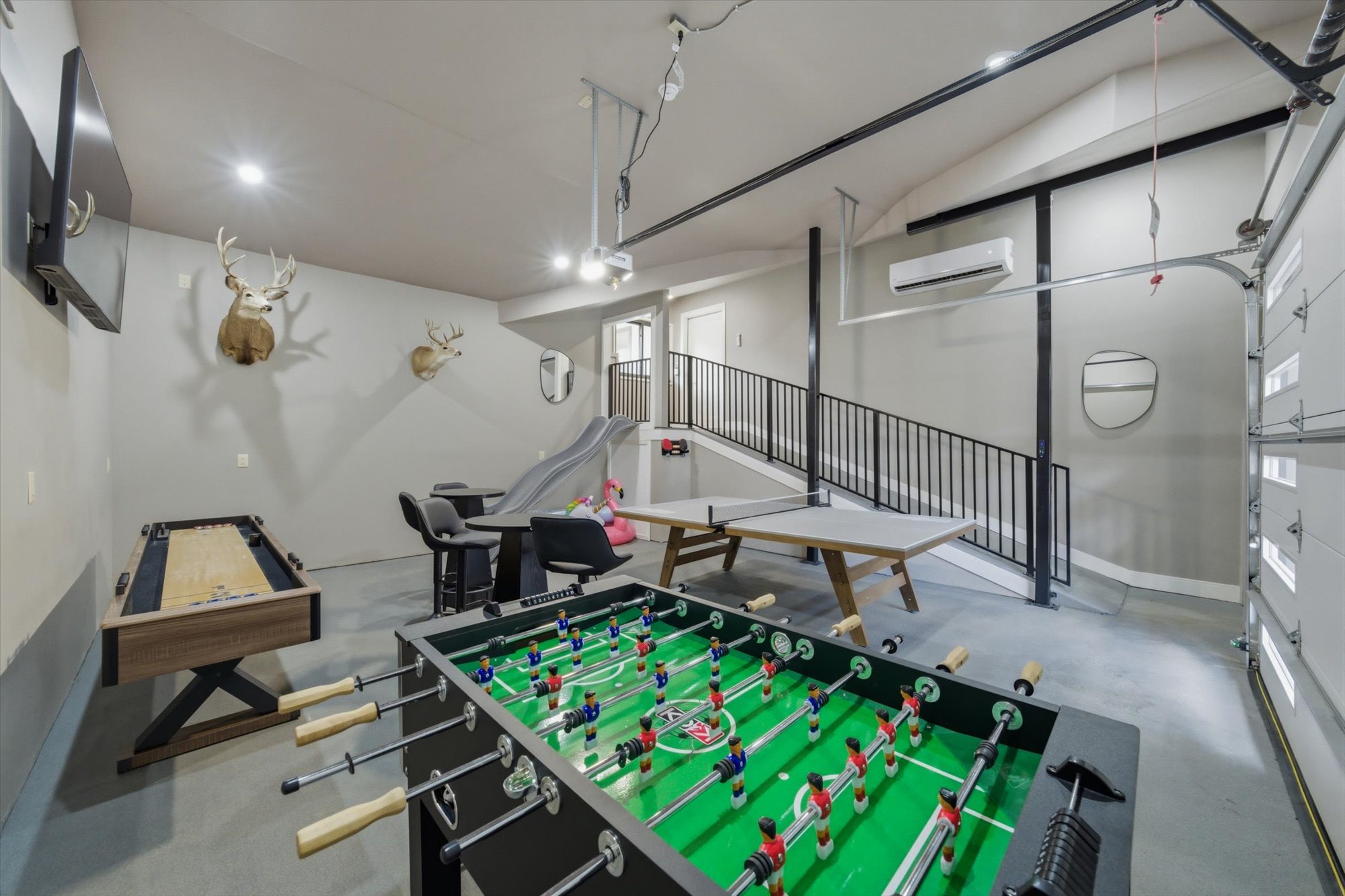 Game room with foosball, shuffleboard, and ping pong